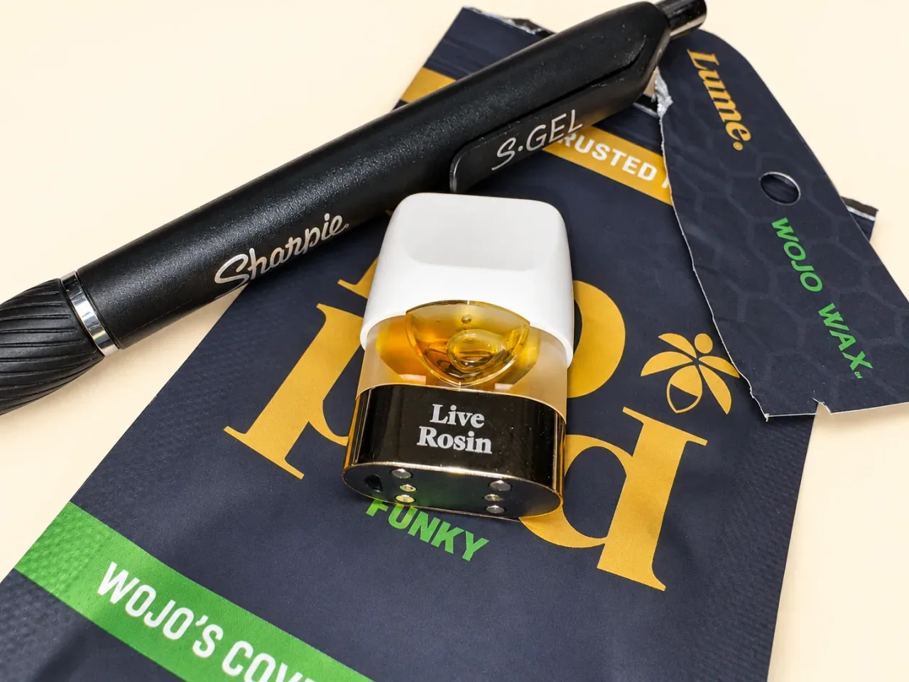 The Donny Double live rosin pod beside a black Sharpie pen for scale